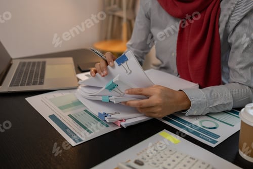 Preview: a muslim company employee works in a large financial organization