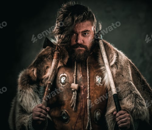 Preview: Viking with cold weapon in a traditional warrior clothes