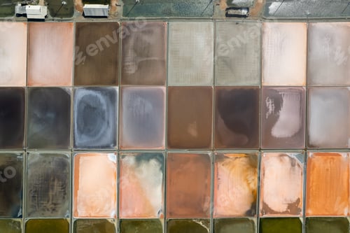 Preview: Aerial drone photo of colourful salt flats textures in Phetchaburi, Thailand