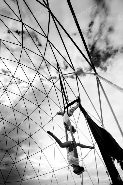 Preview: Healthy alternative fitness aerial fabrique lifestyle with two young beautiful athletes