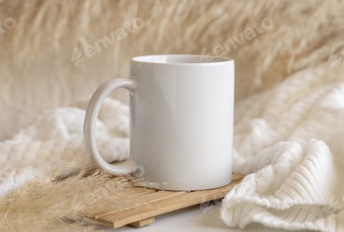 Preview: White coffee mug on wooden tray near pampas grass and cosy sweater, Close up, mock up