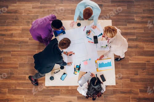 Preview: High angle of a multiracial business people having a meeting in an office