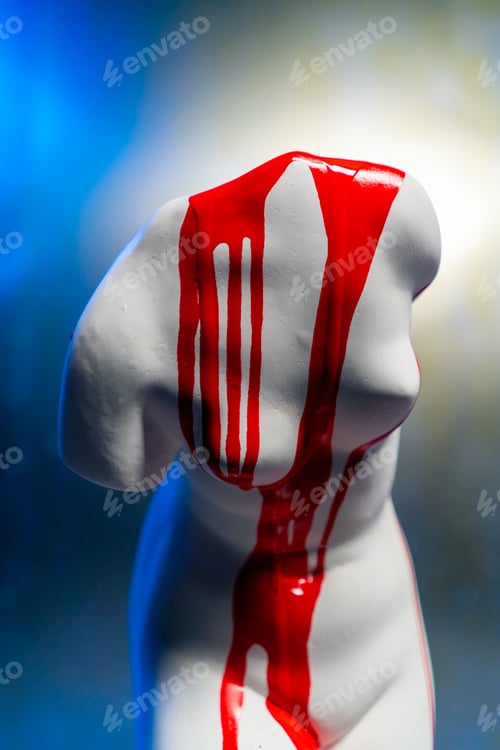 Preview: close-up white sculpture in the form of a body standing on a barrel museum exhibit covered red paint
