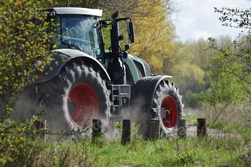 Preview: Shot of a tractor fendt in the garden in a sunny day