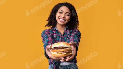 Preview: Funny African American Lady Giving Burger At Studio