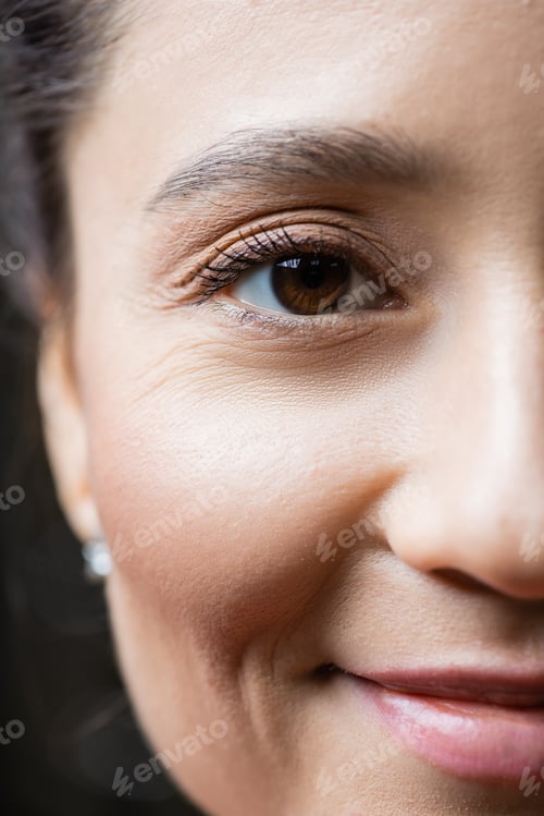Preview: cropped view of smiling woman looking at camera, eye care concept
