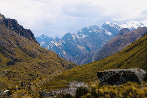 Preview: Landscape shot of serene snow-capped mountain peaks