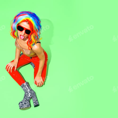 Preview: Fashion Party Lady in
multicolored wig and zebra boots. Club Disco style 90s. Minimal concept