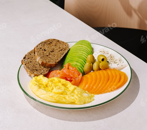 Preview: Fresh breakfast platter with eggs, avocado, and smoked salmon in a cafe