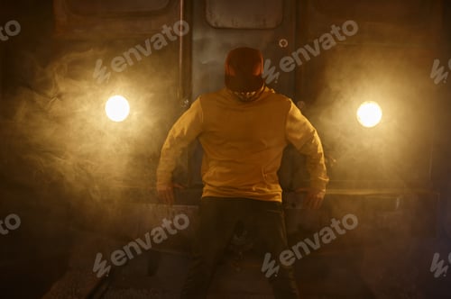 Preview: Portrait of breakdancer preparing for performance standing in smoke