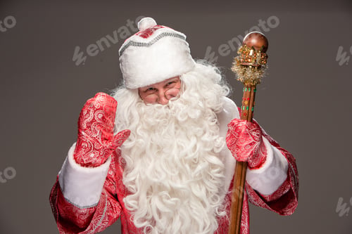 Preview: Happy Santa Claus In Eyeglasses With Staff Looking At Camera On Black Background