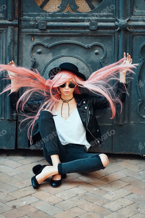 Preview: girl with pink hair posing on city street