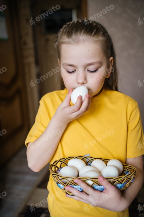 Preview: girl with a basket of white Easter eggs