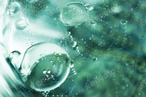 Preview: A beautiful and colorful macro of oil bubbles on water with a pl