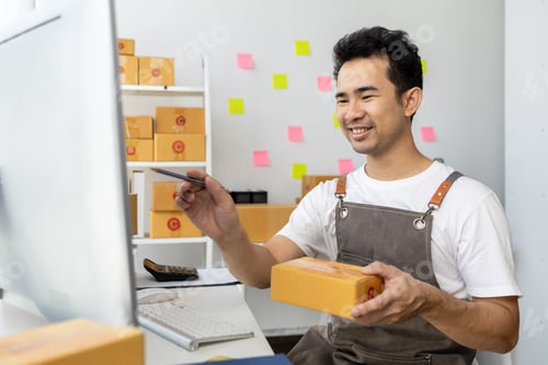 Preview: Male online shop owner, online shop owner distributes products on website, packs products according