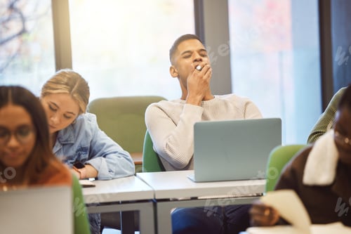 Preview: Education, man and student tired, classroom and studying for exams, laptop and learning. Male, acad