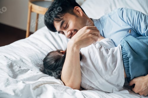 Preview: Father and daughter playing together in bedroom