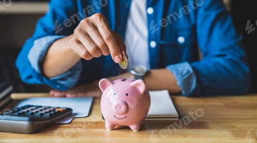 Preview: woman holds a coin in a pig-shaped piggy bank to save money for the future. after retirement and rec