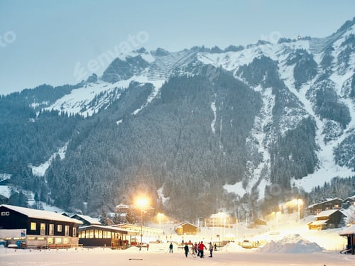 Preview: Group of skiers on floodlit ski slope, Wengen, Switzerland