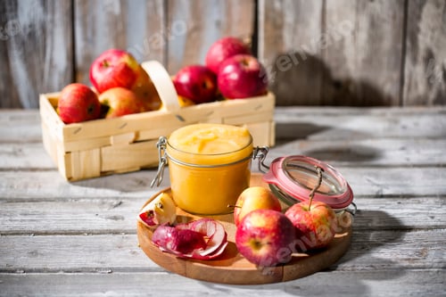 Preview: Preserving jar of homemade applesauce and apples
