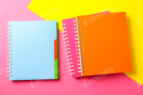 Preview: Composition with copybooks on two tone background, space for text