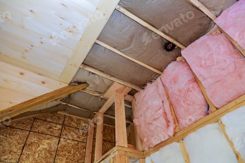 Preview: Attic loft insulation partly insulated wall covering view of layers of pink fiberglass barrier