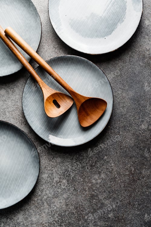 Preview: Empty blue ceramic food set with plates and wooden kitchen utensils