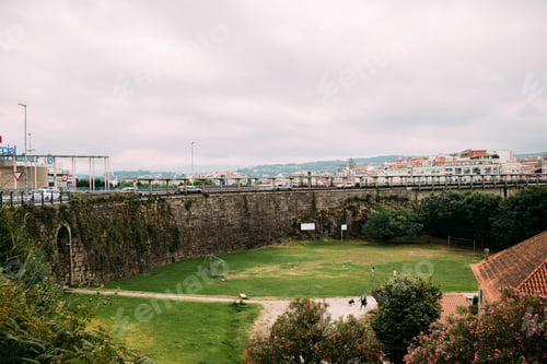 Preview: Soccer field. Green. Urban scene. Bridge. Light and airy.