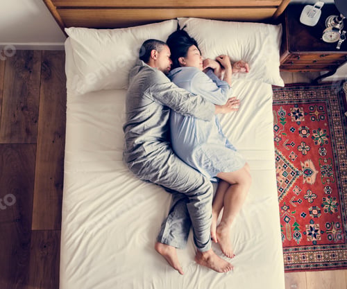 Preview: Interracial couple sleeping together on the bed