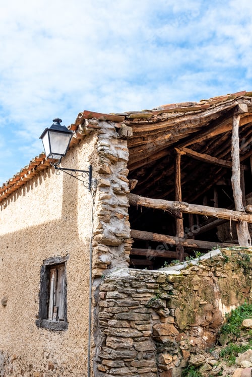 Preview: Old collapsed house with wooden timbers in the village of Horcajuelo de la Sierra in Madrid, Spain.