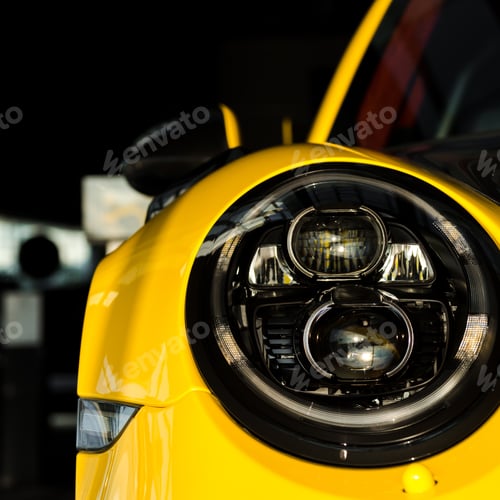Preview: KYIV, UKRAINE - OCTOBER 7, 2019: close up of modern headlight in yellow porshe