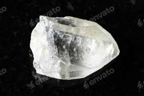Preview: sample of raw rock-crystal on black granite