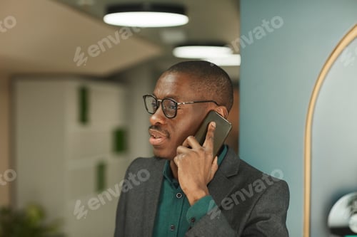 Preview: Businessman using mobile phone