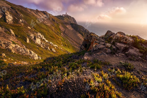 Preview: Cabo da Roca Lighthouse at sunlight and beautiful coastline hill scenery. Most westerly point of the