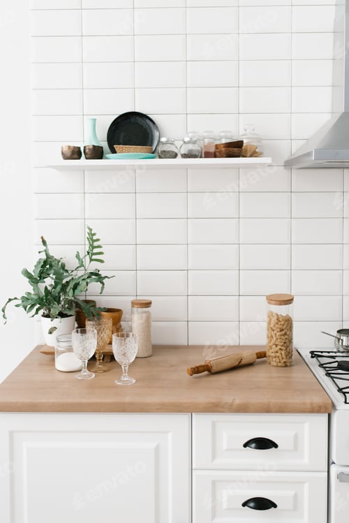 Preview: Bright Kitchen in Scandinavian Style. Pasta in Glass Jar, Houseplant, Glasses, Kitchen Utensils