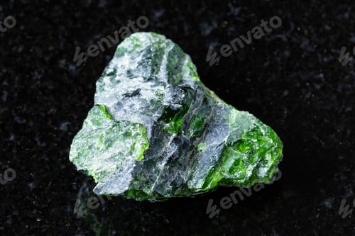 Preview: sample of rough chromian diopside rock on black