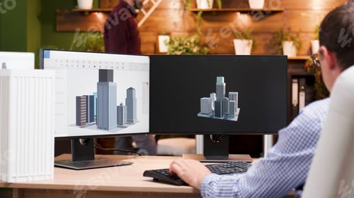 Preview: Engineer man working at architectural building prototype on computer