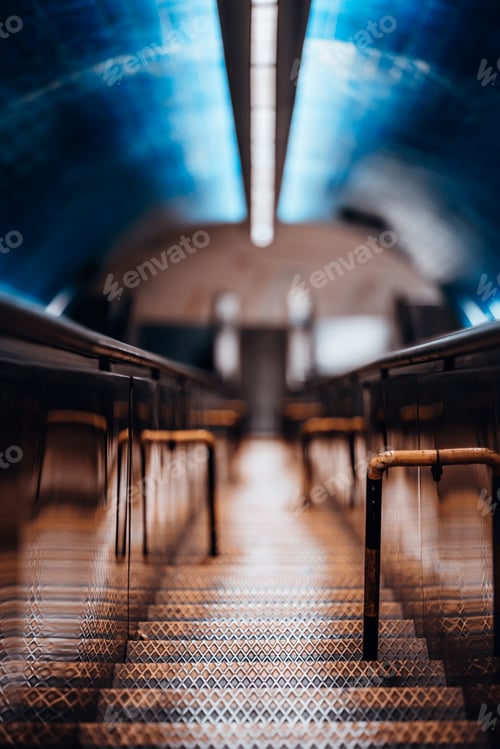 Preview: Metal stairs between two escalators