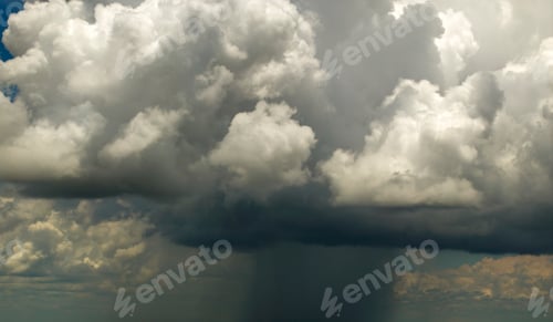 Preview: Rain shower water pouring down from stormy clouds during summer thunderstorm in Florida