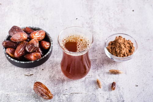 Preview: Alternative coffee from ground date seeds on the table. Avoiding caffeine.