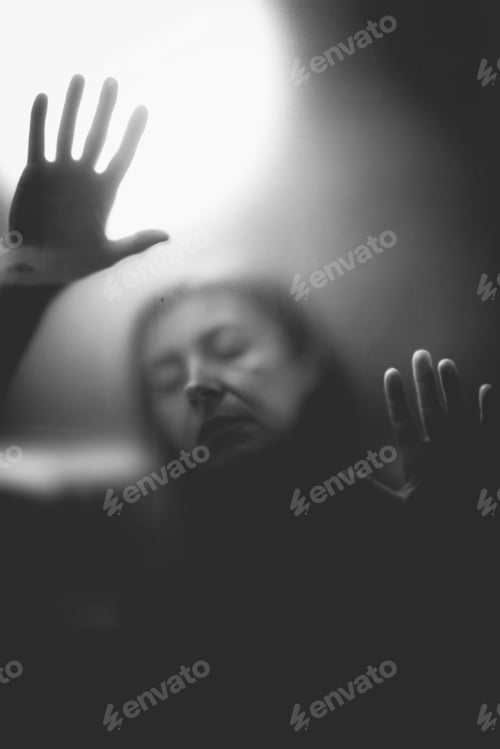 Preview: Scary picture of hands behind glass, horror ghost behind door, Halloween concept