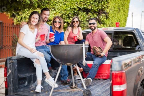 Preview: Friends hanging out on the back of a pick up truck