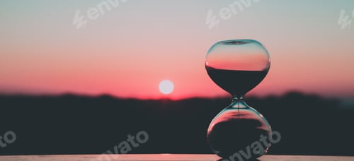 Preview: Hourglass against the background of the rising sun