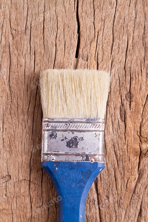 Preview: old paintbrush on wooden background