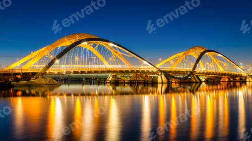 Preview: A bridge in the city at night. The bridge against the sky during the blue hour. Architecture and des
