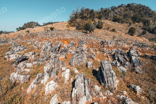 Preview: Rocks and farmland are dry during the hot summer days.