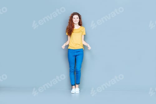 Preview: Great Mood. Cheerful Delighted Positive Woman Looking At You And Smiling While Showing Her Great