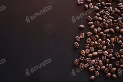 Preview: close up of roasted coffee beans on black background with copy space