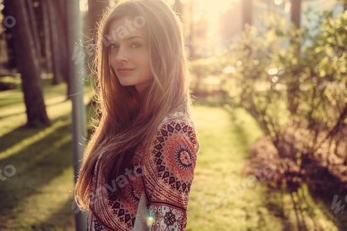 Preview: Portrait of long hair female in a park.