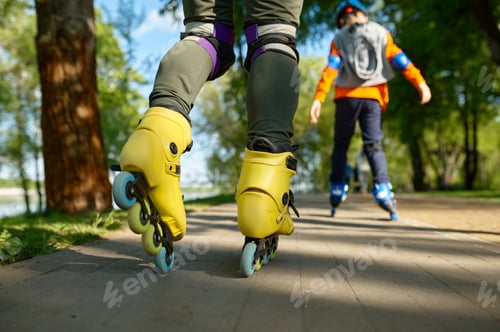 Preview: Active people on roller skates in park road closeup view